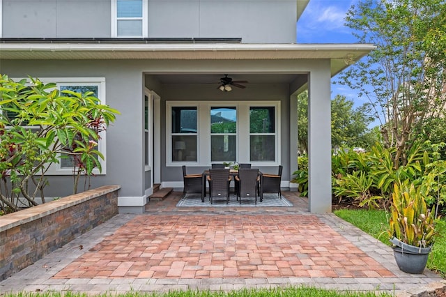 8692 Tavistock Lakes Blvd, Orlando, FL 32827 - view of patio featuring a ceiling fan and outdoor dining space