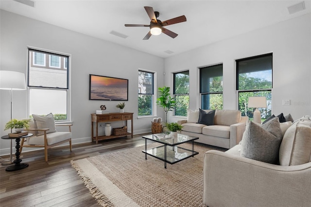 8692 Tavistock Lakes Blvd, Orlando, FL 32827 - living room featuring healthy amount of natural light, wood finished floors, and a ceiling fan