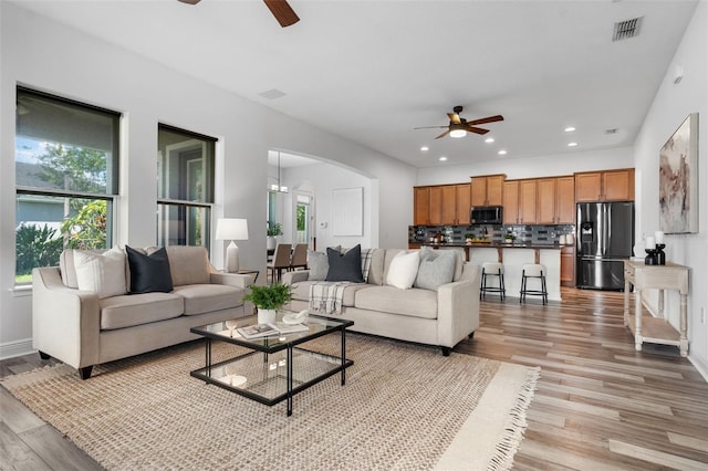 8692 Tavistock Lakes Blvd, Orlando, FL 32827 - living area with a ceiling fan, plenty of natural light, light wood-style flooring, and recessed lighting