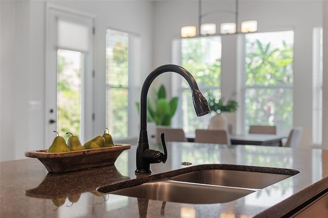 8692 Tavistock Lakes Blvd, Orlando, FL 32827 - kitchen view of dark stone countertops