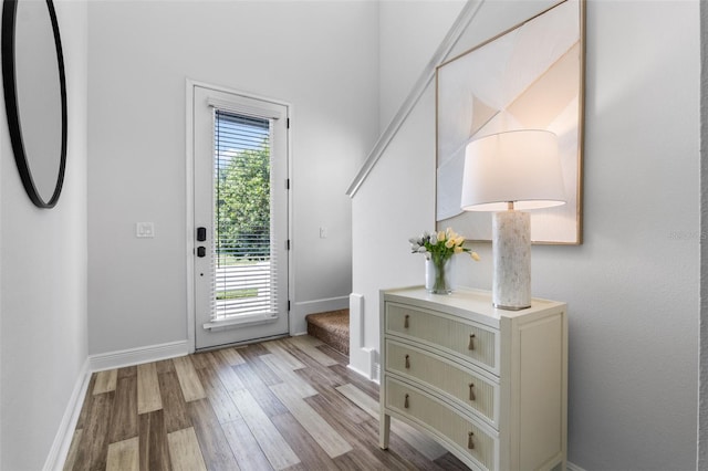 8692 Tavistock Lakes Blvd, Orlando, FL 32827 - doorway to outside with wood finished floors and baseboards