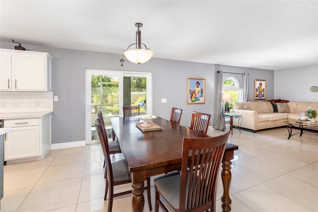 3063 Mandolin Dr, Kissimmee, FL 34744 - dining area with plenty of natural light and light tile patterned flooring