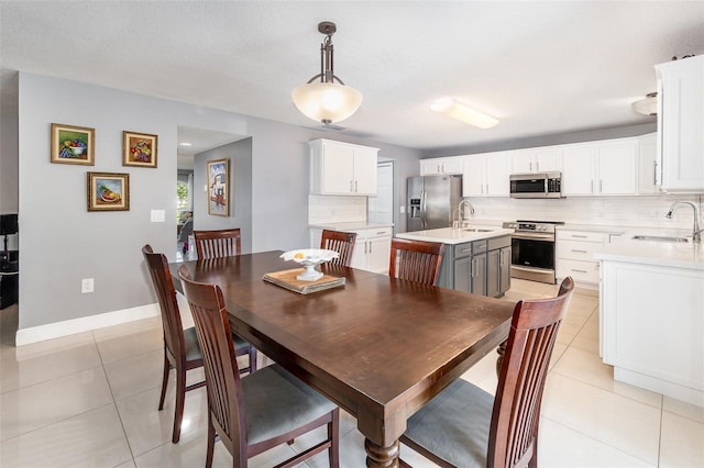 3063 Mandolin Dr, Kissimmee, FL 34744 - dining area featuring light tile patterned floors and baseboards