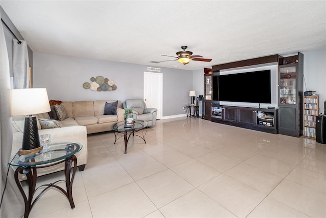 3063 Mandolin Dr, Kissimmee, FL 34744 - tiled living area featuring a ceiling fan and baseboards