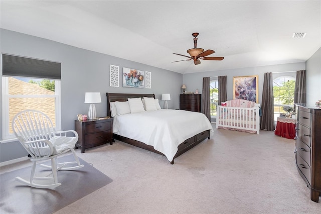 3063 Mandolin Dr, Kissimmee, FL 34744 - bedroom with multiple windows, light carpet, and ceiling fan