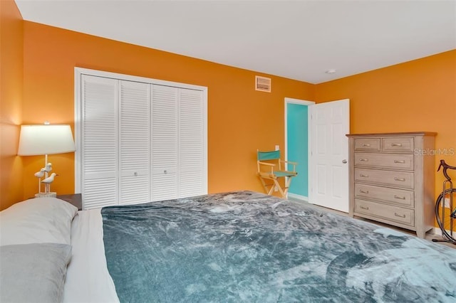 bedroom with a closet and baseboards