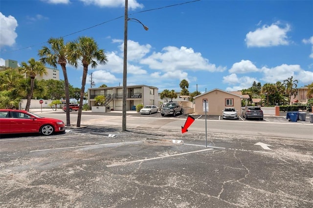 uncovered parking lot with a residential view
