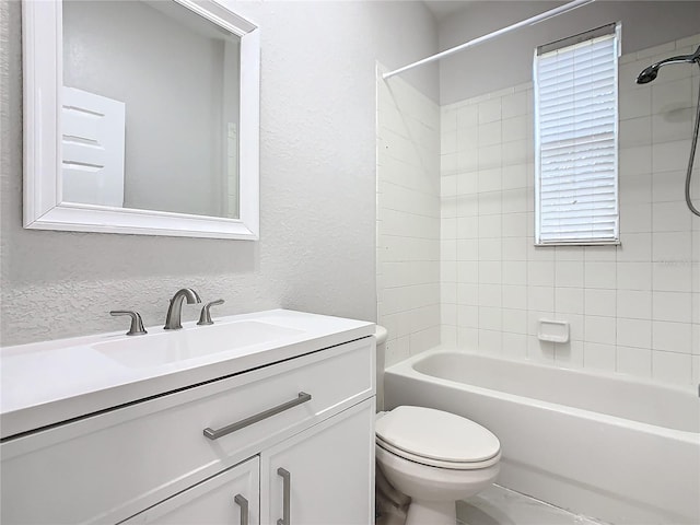 3000 Laurel Park Ln Unit 202, Kissimmee, FL 34741 - bathroom with toilet, vanity, bathtub / shower combination, and a textured wall