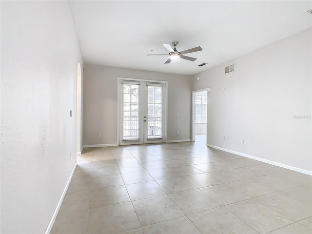 3000 Laurel Park Ln Unit 202, Kissimmee, FL 34741 - unfurnished room with french doors, a ceiling fan, light tile patterned flooring, and baseboards