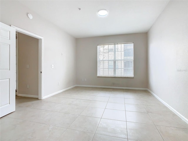 3000 Laurel Park Ln Unit 202, Kissimmee, FL 34741 - unfurnished room with light tile patterned floors and baseboards