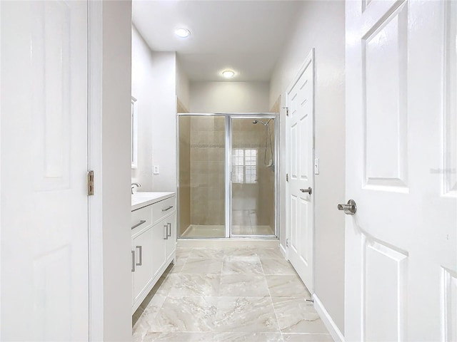 3000 Laurel Park Ln Unit 202, Kissimmee, FL 34741 - bathroom with baseboards, a stall shower, vanity, and marble finish flooring