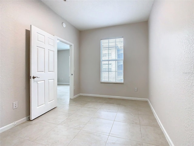 3000 Laurel Park Ln Unit 202, Kissimmee, FL 34741 - unfurnished room with light tile patterned floors and baseboards