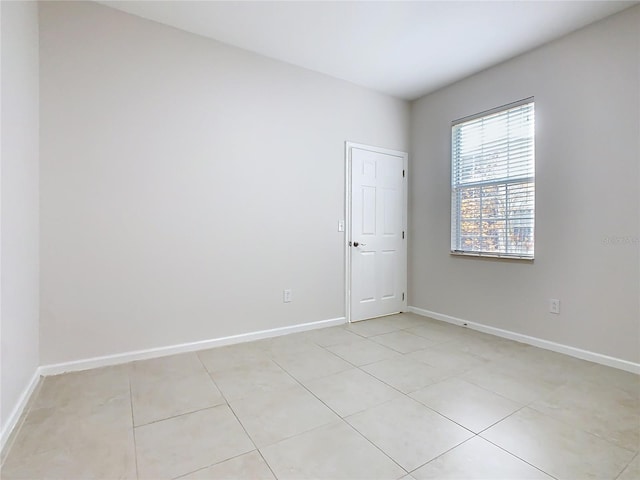 3000 Laurel Park Ln Unit 202, Kissimmee, FL 34741 - spare room featuring baseboards and light tile patterned floors