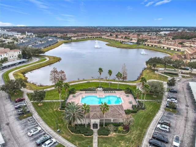3000 Laurel Park Ln Unit 202, Kissimmee, FL 34741 - drone / aerial view of a pool area and a large body of water