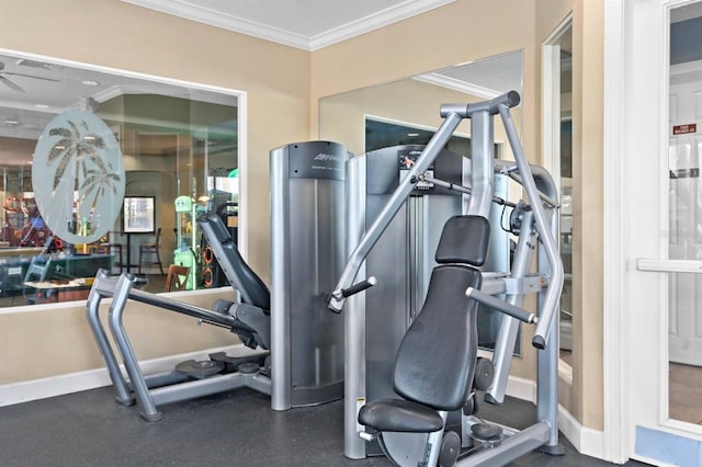 exercise room featuring ornamental molding and baseboards