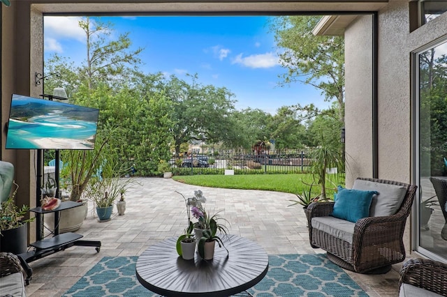 view of patio / terrace featuring fence