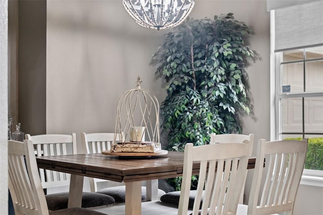 dining space with a chandelier