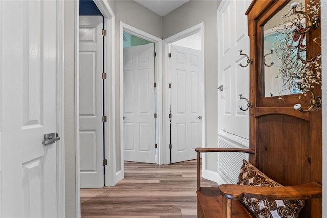 entryway featuring light wood-style flooring and baseboards
