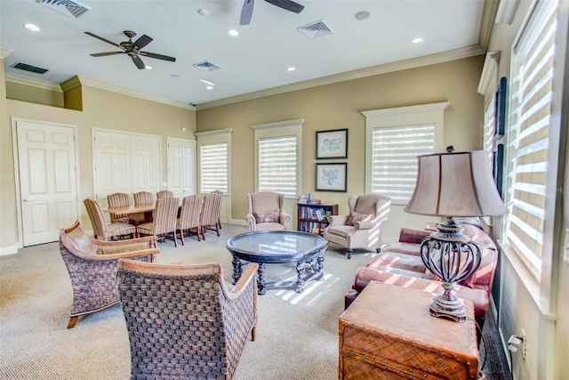 living area featuring carpet, a ceiling fan, ornamental molding, recessed lighting, and baseboards