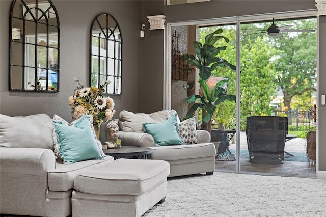 living room featuring healthy amount of natural light and wood finished floors