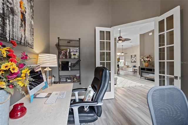 home office featuring wood finished floors, french doors, and ceiling fan