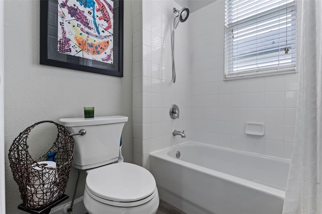 full bathroom with shower / bath combination with curtain and toilet