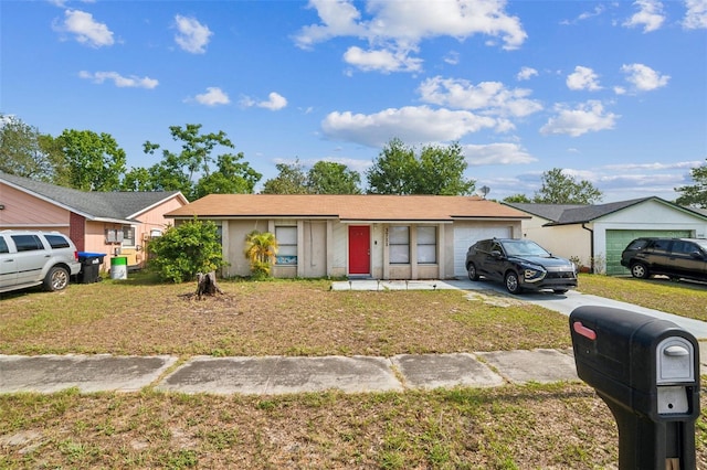 3711 Shady Grove Cir, Orlando, FL 32810 - ranch-style home featuring a garage, a front lawn, and concrete driveway