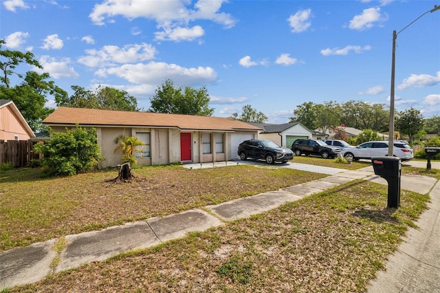 3711 Shady Grove Cir, Orlando, FL 32810 - ranch-style house featuring driveway, a garage, and stucco siding