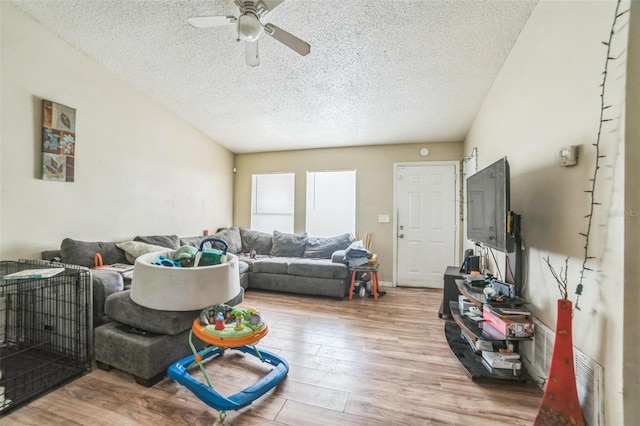 3711 Shady Grove Cir, Orlando, FL 32810 - living room with ceiling fan, a textured ceiling, and wood finished floors