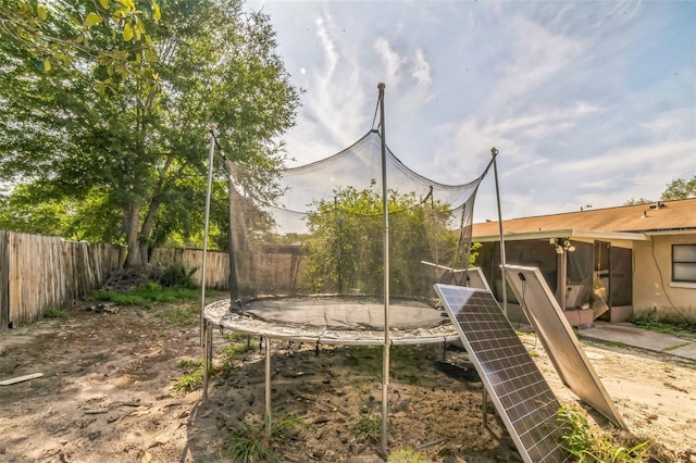 3711 Shady Grove Cir, Orlando, FL 32810 - fenced backyard with a trampoline