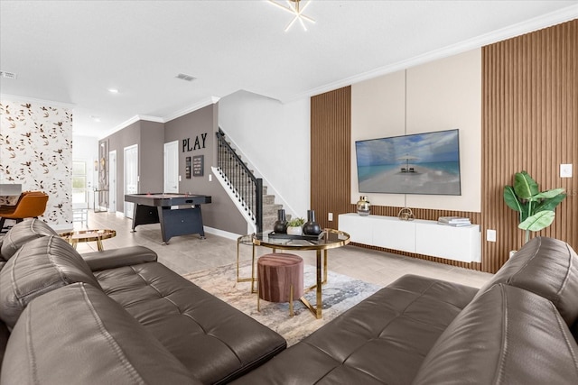 living room with crown molding, stairs, tile patterned flooring, and baseboards