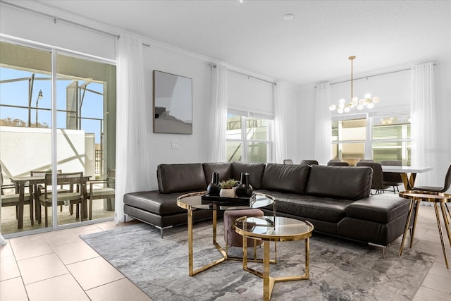 living room with a chandelier and light tile patterned floors