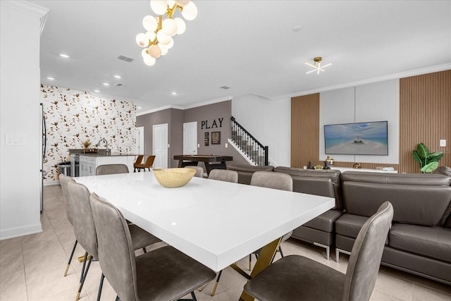 dining room with crown molding, an accent wall, recessed lighting, stairway, and wallpapered walls