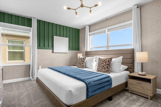 bedroom with carpet flooring, baseboards, and wallpapered walls