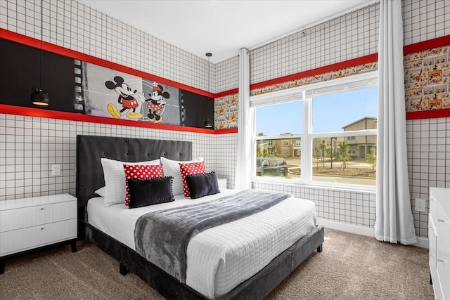 carpeted bedroom with tile walls