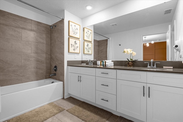 bathroom with shower / bathtub combination with curtain, tile patterned floors, double vanity, and a textured ceiling