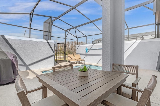 view of patio with an outdoor pool, glass enclosure, and outdoor dining area