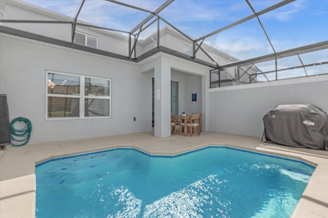 swimming pool featuring a patio, area for grilling, and a lanai