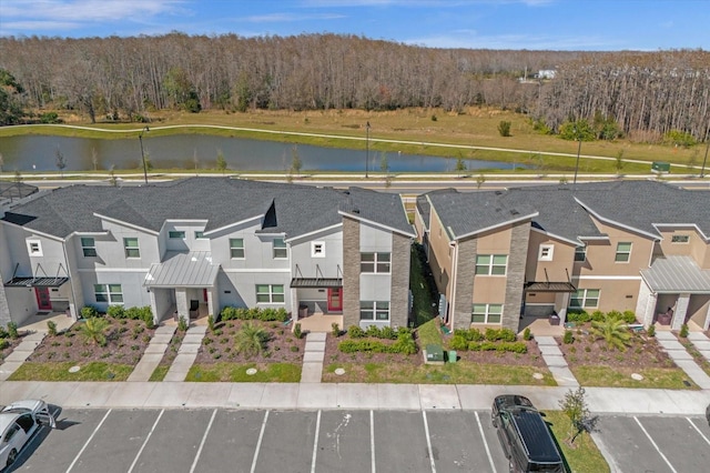 aerial perspective of suburban area featuring a large body of water