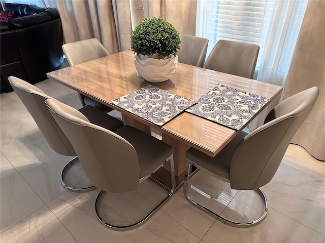 4412 Conroy Club Dr, Orlando, FL 32835 - dining area featuring marble look tiles
