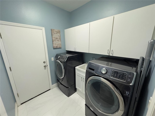 4412 Conroy Club Dr, Orlando, FL 32835 - laundry area featuring separate washer and dryer, cabinet space, and baseboards