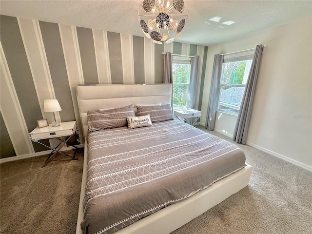 carpeted bedroom with baseboards and wallpapered walls