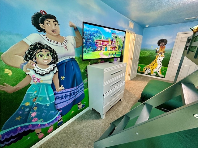 rec room featuring carpet flooring and a textured ceiling