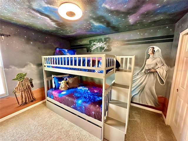 carpeted bedroom with baseboards