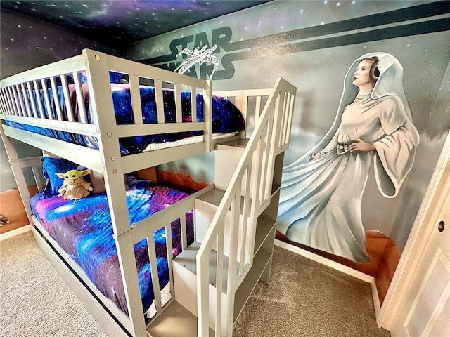 bedroom featuring carpet floors and baseboards