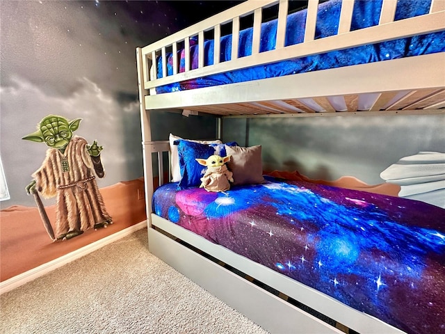 bedroom with carpet floors and baseboards