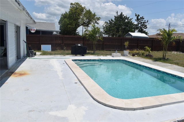 821 Silver Springs Ter NW, Port Charlotte, FL 33948 - view of swimming pool featuring a fenced backyard, a patio, and grilling area