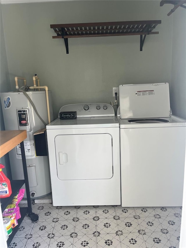 821 Silver Springs Ter NW, Port Charlotte, FL 33948 - washroom with washing machine and clothes dryer and electric water heater