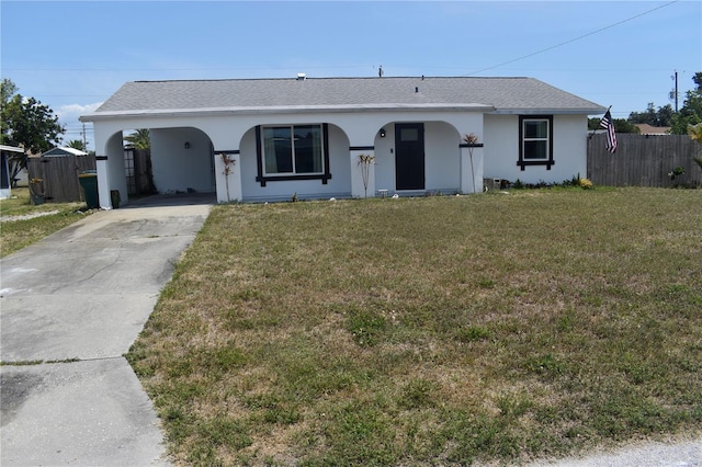 821 Silver Springs Ter NW, Port Charlotte, FL 33948 - view of front of home with driveway, an attached carport, and stucco siding
