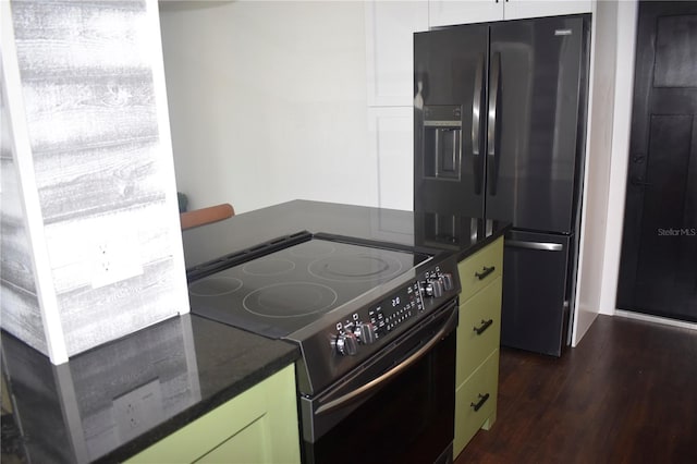 821 Silver Springs Ter NW, Port Charlotte, FL 33948 - kitchen with black appliances and dark wood finished floors